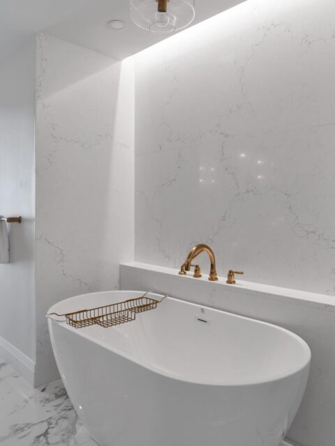 Fun fact: This entire condo was designed remotely. The homeowners were in Toronto. The condo and builder were in Florida. Meanwhile, I was up here, relying on weekly FaceTime walkthroughs and an incredible team on the ground to bring everything together.

You would think that would make designing something as detail-heavy as a bathroom nearly impossible. Honestly though, it just meant asking the right questions upfront and paying extra attention to the little things.

The goal was to create a Florida retreat that felt bright, breezy and easy to live in. We kept the palette crisp and timeless with oversized marble-look tile, warm brass fixtures and a dedicated vanity that turns getting ready into a slower, more enjoyable ritual. 

We also reworked the layout so the bathroom supports a smarter floor plan, making it easy for family and overnight guests to share the home comfortably.

Interior Design @mcnicolinteriordesigns

📍West Palm Beach Interior Designer
#floridacondoinspo #westpalmbeachinteriordesigner #bathroomaesthetic