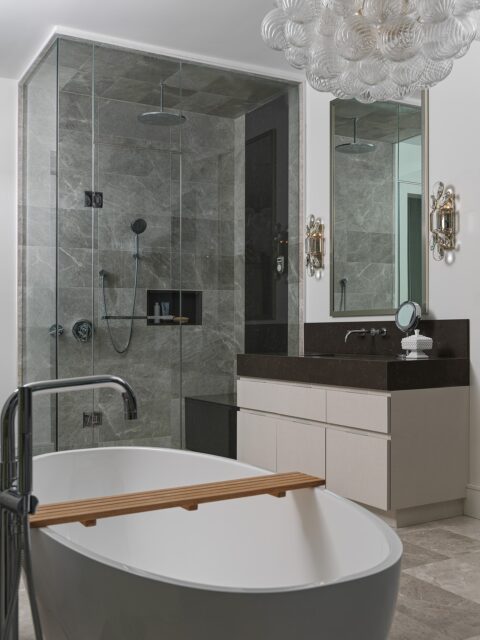 If I had this bathtub upstairs, I fear I’d become veryyy difficult to reach after about 8 PM. And that was sort of the point here.

Project Niagara’s third floor was designed to give our clients their own self-contained retreat—with a bedroom, walk-in closet, kitchenette and this ensuite all together. So naturally, the bathroom needed to feel worthy of lingering in too.

There’s a big walk-in shower for real-life weekday mornings, and then THIS setup for when life can slow down a little: freestanding tub, greenery outside the windows, soft curtains and that dreamy chandelier overhead.

Photography: @arnalphotography

📍McNicol Interior Designs | Toronto Interior Designer

#torontointeriordesign #homerenovation #bathroomdesign